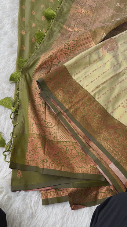 The Natural Beauty Olive Green Color Saree With The Rich Copper Zari border